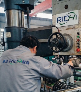 RICHI workers debug equipment